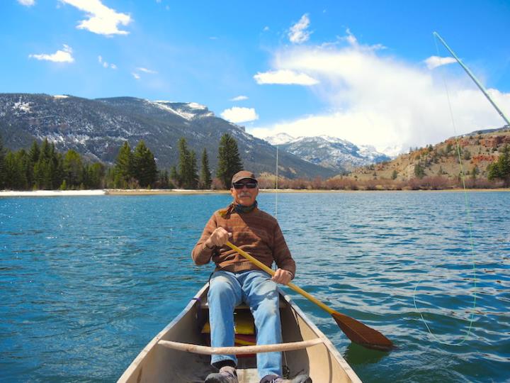 Bayard Fox rowing a wooden boat